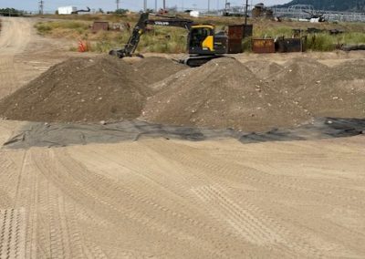 Toncar bulldozer with piles of sand