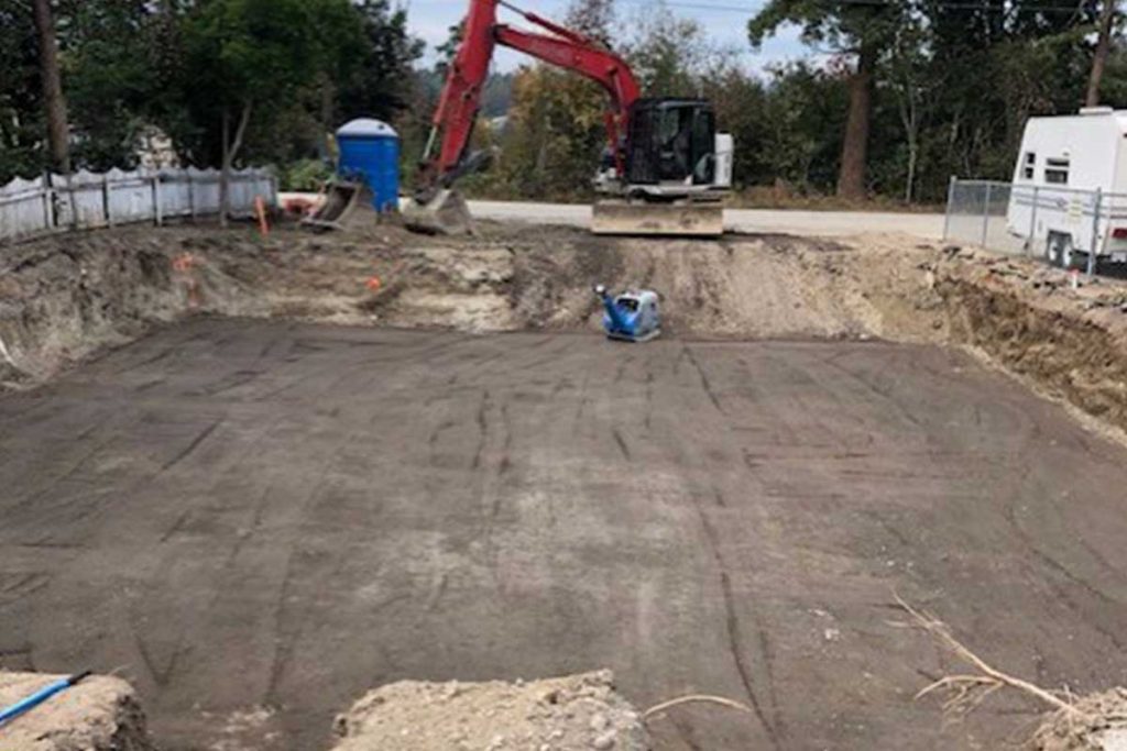 Toncar installing large concrete pad civil construction