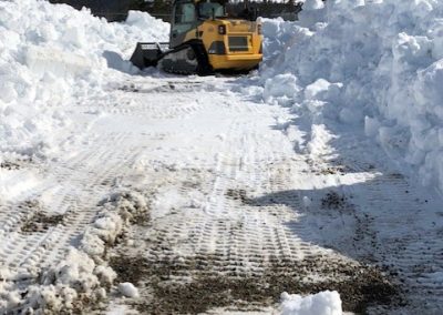 Toncar bulldozer plowing snow