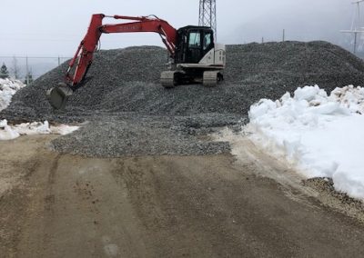 Toncar digger up on hill of gravel