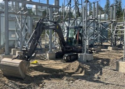 Toncar digging trench near hydroelectric project2