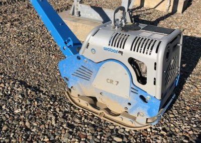 Toncar pressing down rock platform at hydroelectric project